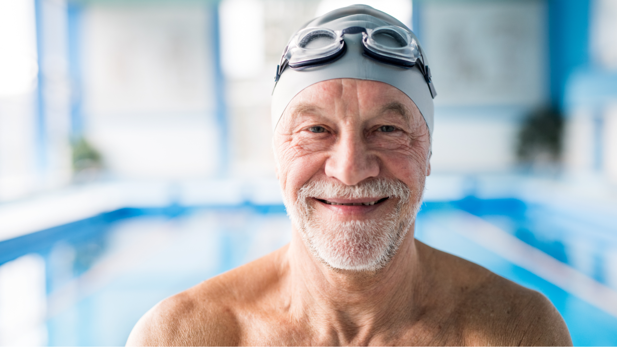 older man in swimming pool to do mild exercise for arthritis in his feet