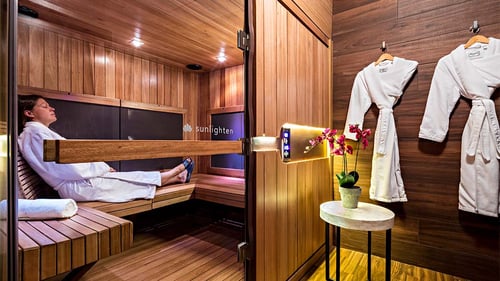 A woman relaxes in the Infrared Sauna at the Chambers Center for Well-Being.