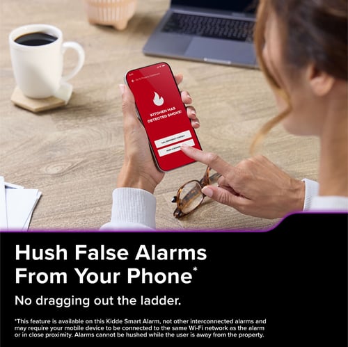 A woman clicks a button on her phone. The text below reads "Hush False Alarms from Your Phone* No dragging out the ladder."
