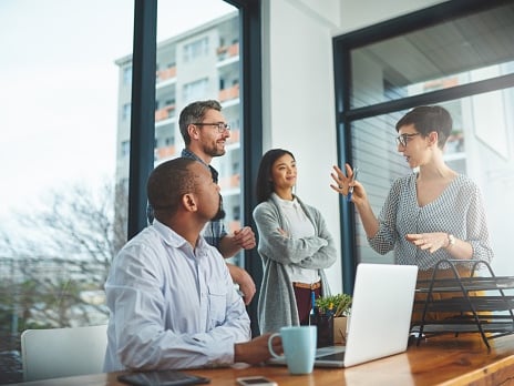 Four business professionals having a team meeting.