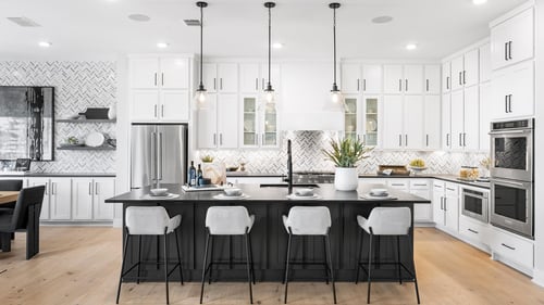 Stunning kitchen with breakfast bar, ample cabinet, and countertop space