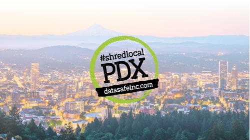 Distant view of Portland, Oregon skyline overlaid with Graphic with black text saying, "#ShredLocalPDX datasafeinc.com"