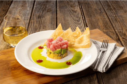 Ahi tuna, avocado, mango & pineapple stack with cilantro oil and wonton crisps on the side