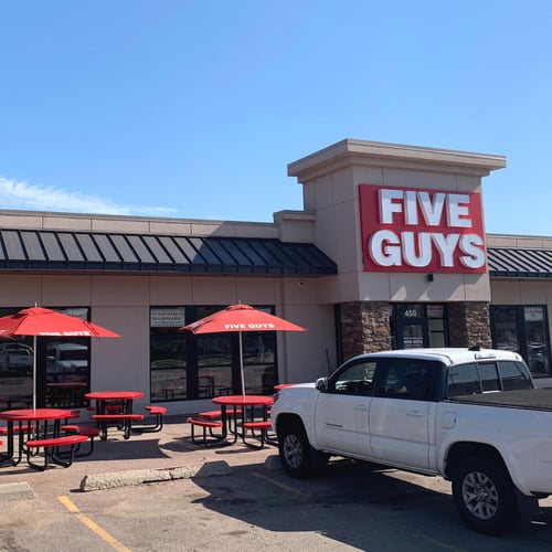 Exterior photograph of the entrance to the Five Guys restaurant at 121 S. Minnesota Avenue in Sioux Falls South Dakota.