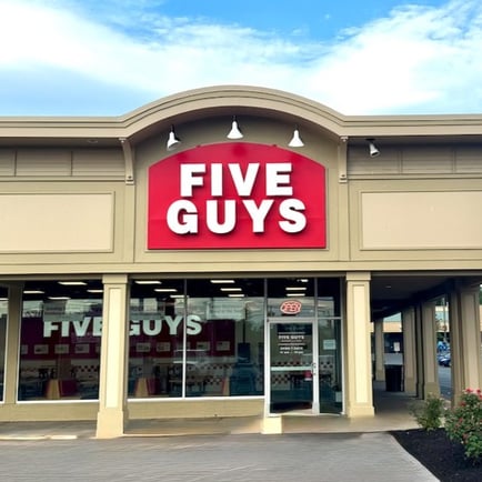 Exterior photograph of the Five Guys restaurant at 900 Central Avenue in Albany New York.