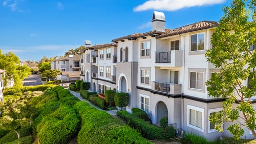 A row of houses with a clear blue sky above them at Missions at Chino Hills Apartments, Chino Hills, 91709