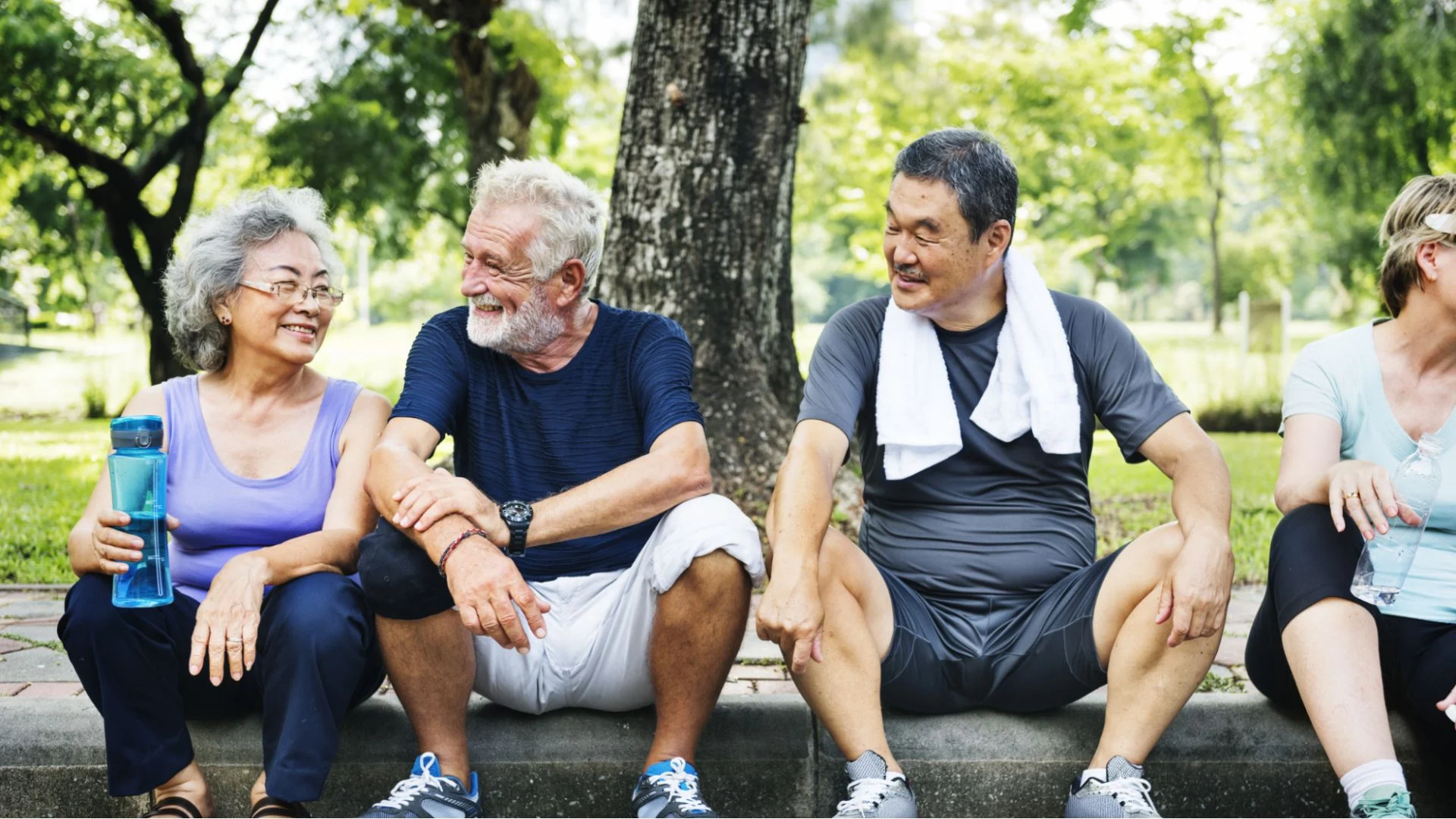 older friends sitting together after mild exercise