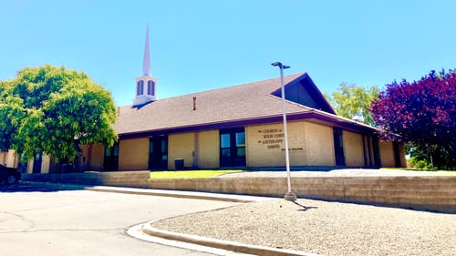 Light tan brick building with brown roof