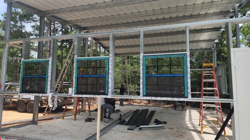 Custom windows being installed during a home addition build