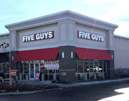 Exterior photograph of the Five Guys restaurant at 335 County Road in Elkhart, Indiana.