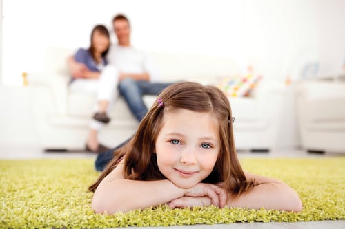 Girl on clean carpet by Lakeshore Chem-Dry.
