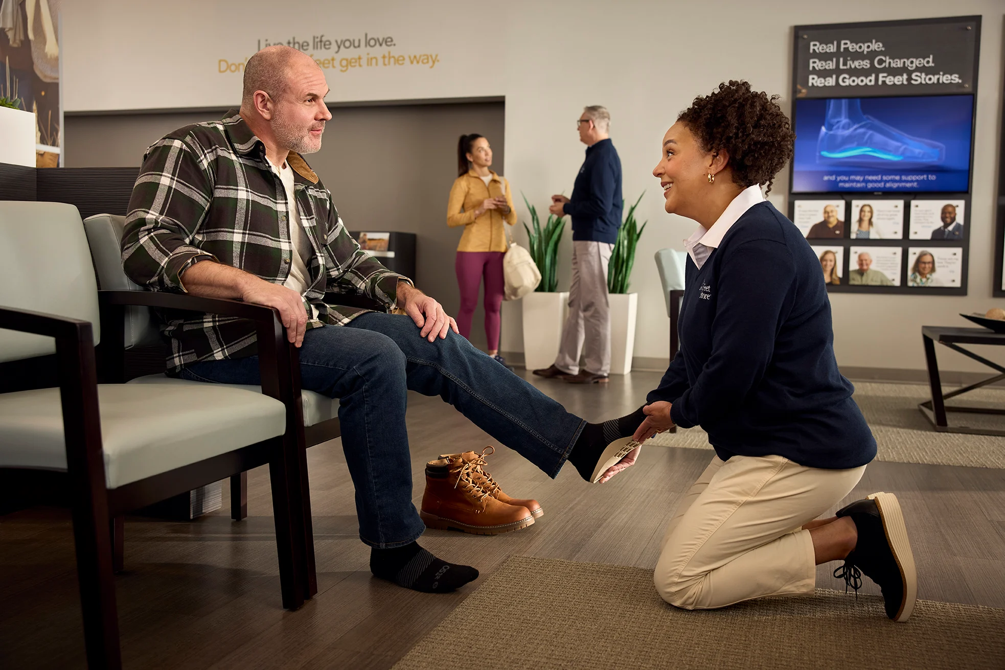 Arch Support Specialist giving free fitting to person at The Good Feet Store