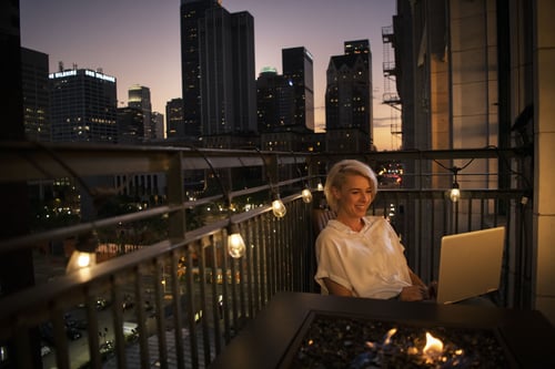 Women on Balcony using a fiber internet