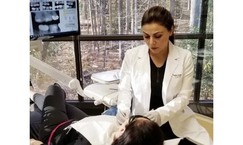A photo of Dr. Darvishian treating a patient in the dental chair.
