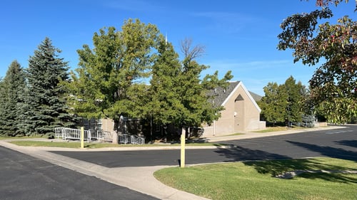 Entrance and parking of the church building at 259 East Alpine Drive, Elk Ridge, UT 84651