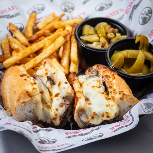 Beef Sandwich with melted Cheese on top.