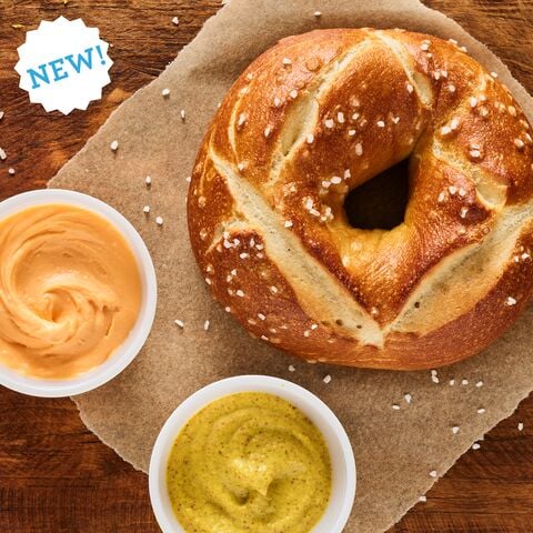 Einstein Bros. Bagels New Pretzel Bagel ​Double Dipper​ offered for a limited time only with a side of mustard and beer cheese shmear