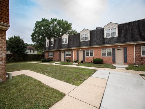 Property exterior at Somerset Woods Townhomes, Severn, MD, 21144.