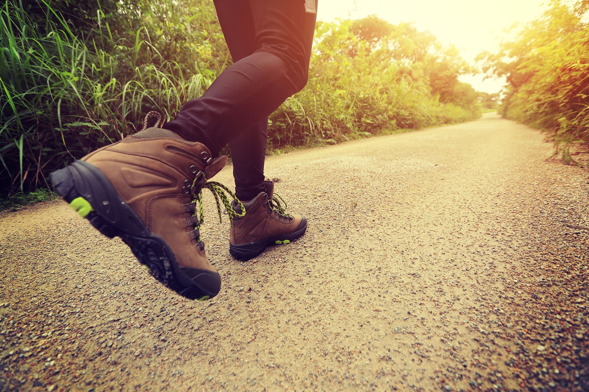 person wearing hiking boots outdoors on a trail