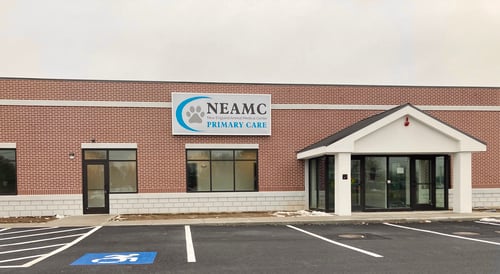 Veterinary hospital building exterior with windows and front entrance.