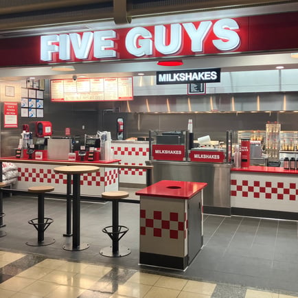 A photo of the Five Guys restaurant located at Concourse D inside Ronald Reagan National Airport in Arlington Virginia.