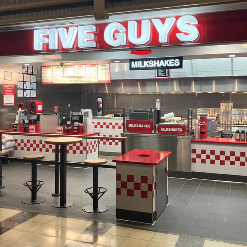 A photo of the Five Guys restaurant located at Concourse D inside Ronald Reagan National Airport in Arlington Virginia.