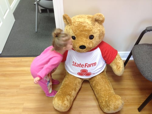Child kissing Neighbear on the cheek