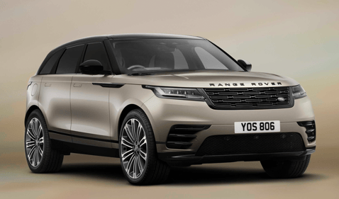 Front view of a champagne Range Rover Velar against a neutral background