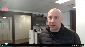 Chris standing in office