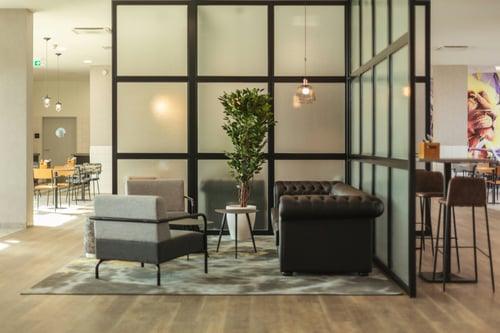 Lobby with comfortable furniture, free Wi-Fi, and workspaces.