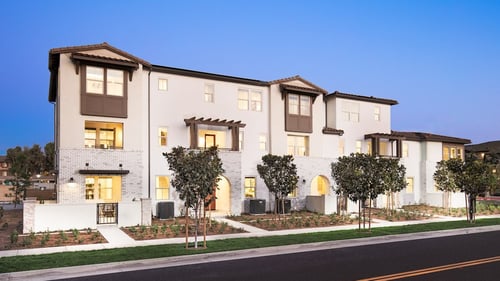 new townhome with white and brown exterior