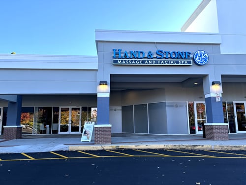 Exterior storefront with signage at Hand & Stone Massage and Facial Spa Asheville NC