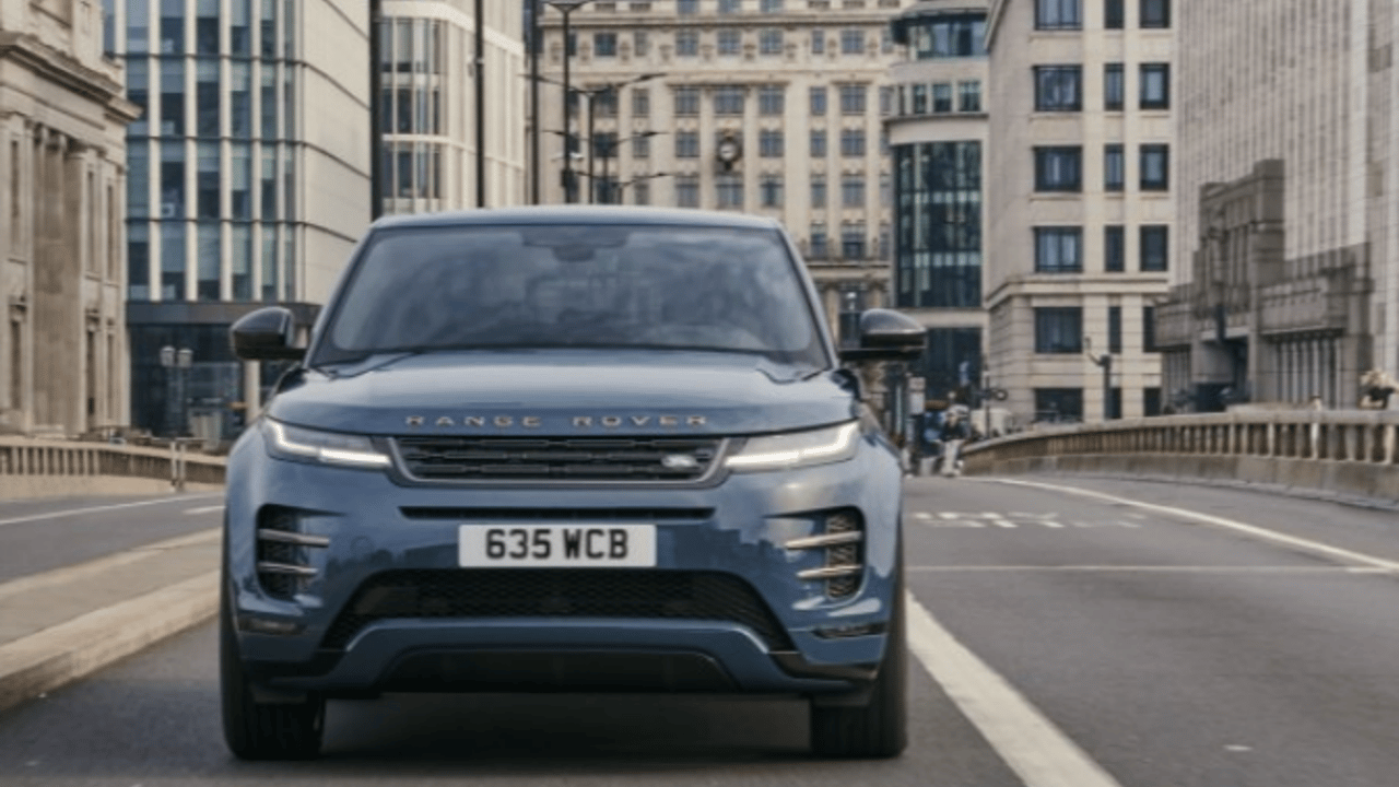 Range Rover driving across a city bridge