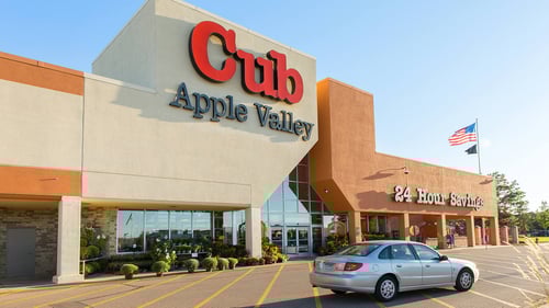 silver car passing by entrance of Cub grocery store at Southport Centre I-VI shopping center