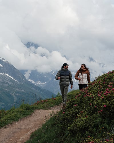 Two people hiking in the mountains.