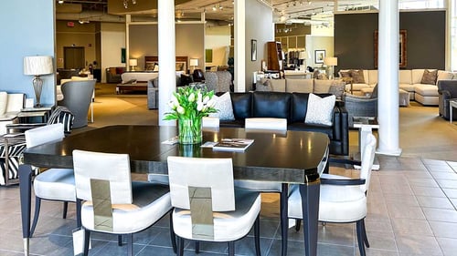 Interior of the Saugus location of Cabot House Furniture featuring a contemporary dining set.