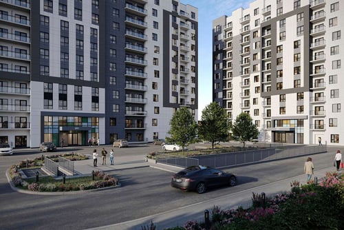 A car is driving down a street lined with modern apartment buildings at Roxy Apartments, Hamilton, ON, L8H 0B7