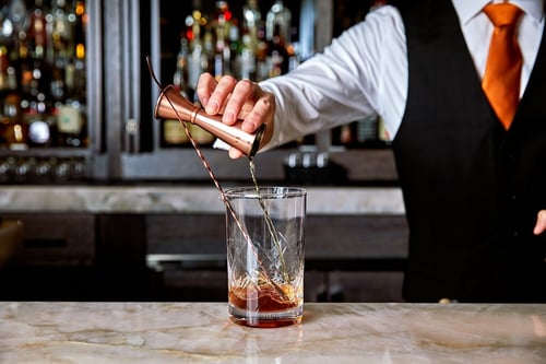 Bartender stirring a cocktail at Cattlemens Lounge Paso Robles.