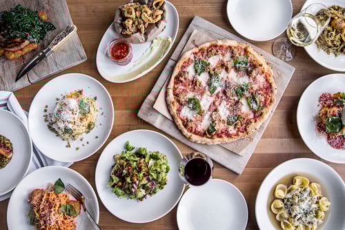 Italtian inspired dishes from Colletta Atlanta on a table.