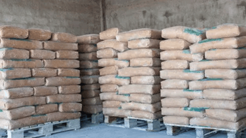 several pallets full of bagged concrete