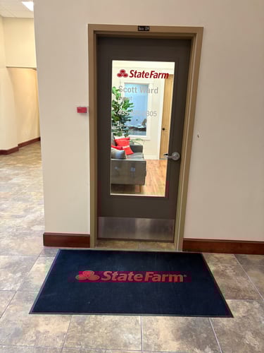 Gray door with black rug with red State Farm logo