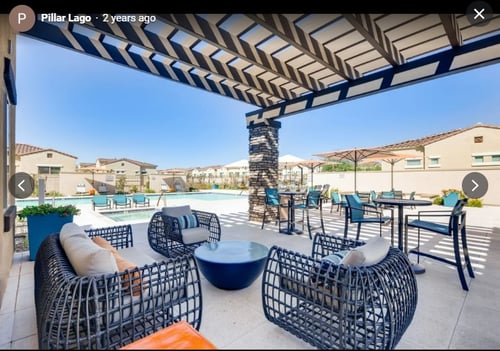 Pillar Lago Apartments lounge area and pool