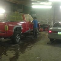 A car receives a fresh coat of paint in a controlled environment, enhancing its appearance and protecting it from the elements. Give your car a new look—book your paint job with us today!