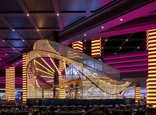 The Glass Bar at Planet Hollywood in Las Vegas offers edgy ombre lighting, ebony-stained wood, opulent brass, and gold-hued marble envelope you in a comfortable, yet elegant lounge experience.