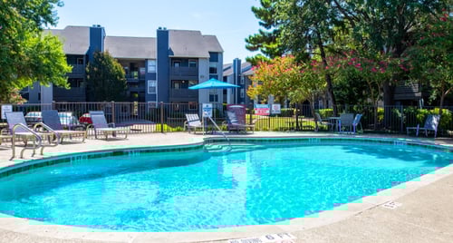 Swimming pool with relaxing chairs at Stassney at SoCo, Austin, Texas