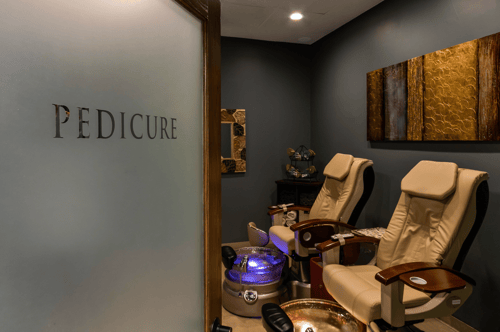 Two massaging pedicure chairs at Zoi'A Spa & Salon in Janesville, WI, in a serene, spa-like area, separated from the salon's busyness and noise.