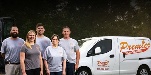 A group photo of the Premier Gasworks team in front of their company van