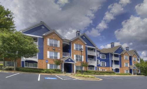 Apartment Buildings at The Crest at Sugarloaf Apartments in Lawrenceville, GA