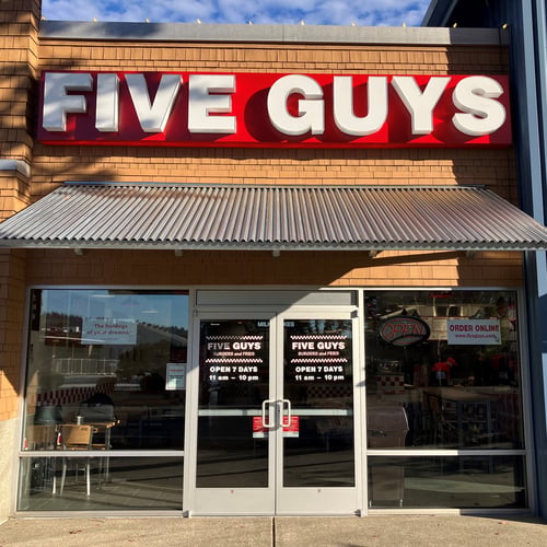 Exterior photograph of the Five Guys restaurant at 13620 Northeast 175th Street in Woodinville Washington.