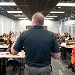 Dan Dalton presenting a leadership development workshop to an engaged audience of business and community leaders at P3:14 Consulting.